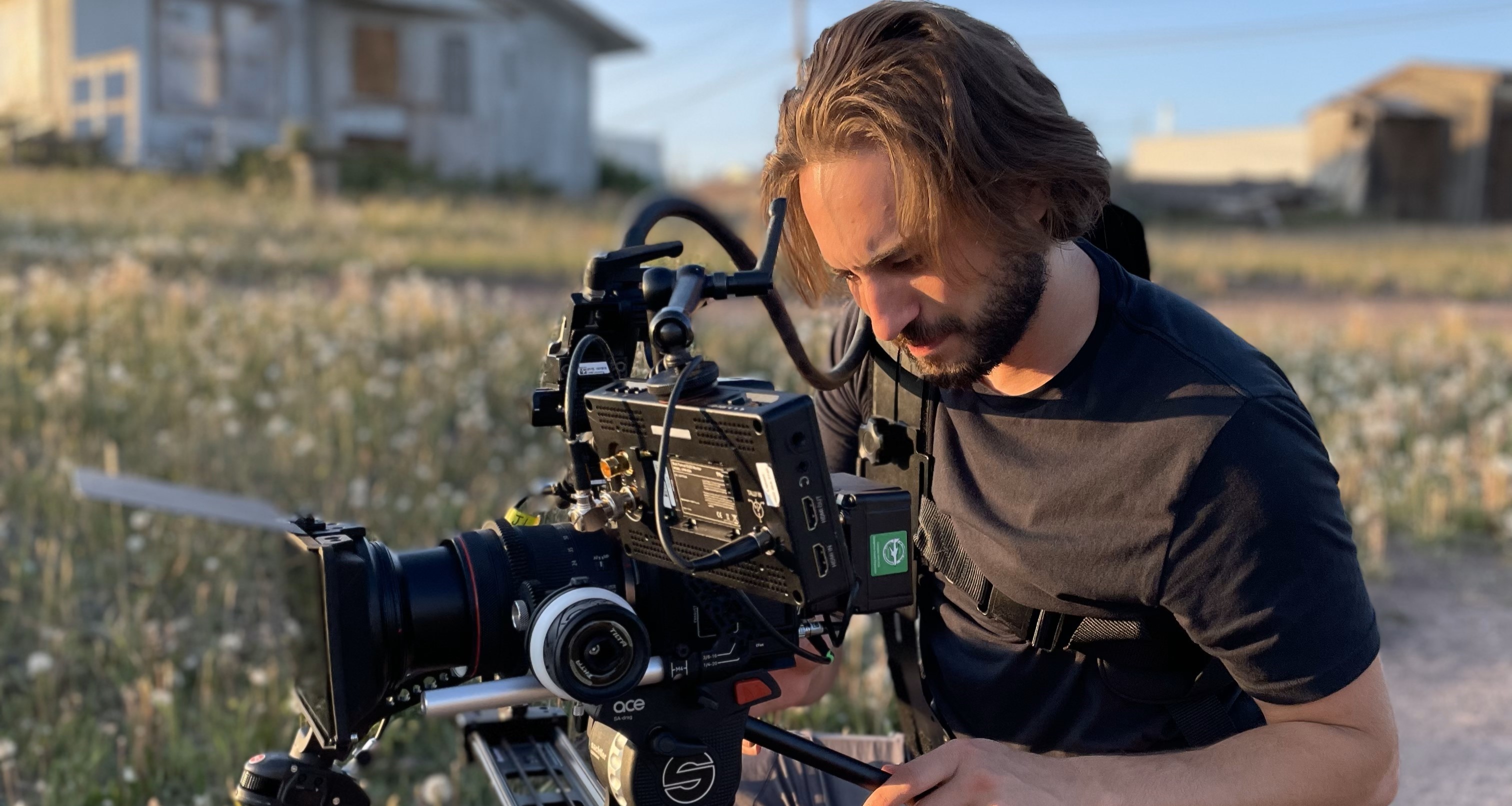 Jeremy Liguori outside behind a camera.